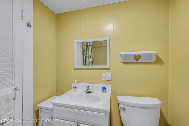 a view of a room with wooden walls