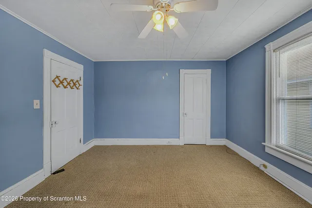 a bathroom with a granite countertop sink mirror vanity and toilet