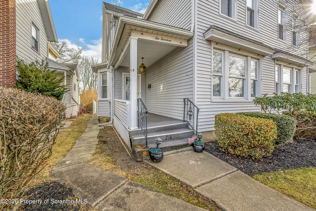 a room with a washing machine and cabinets