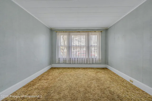 a bathroom with a granite countertop bathtub shower and toilet