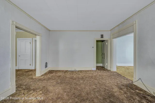 a view of a big room with closet and wooden floor