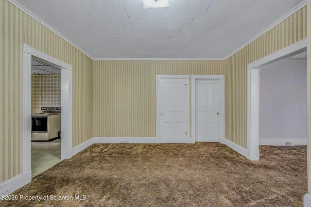 a view of a big room with window and closet