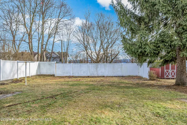 a view of a house with backyard