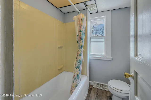 a bathroom with a toilet and a sink