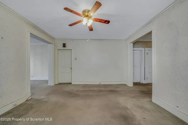 a view of a chandelier fan in a room