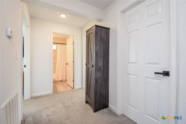 an empty room with closet area