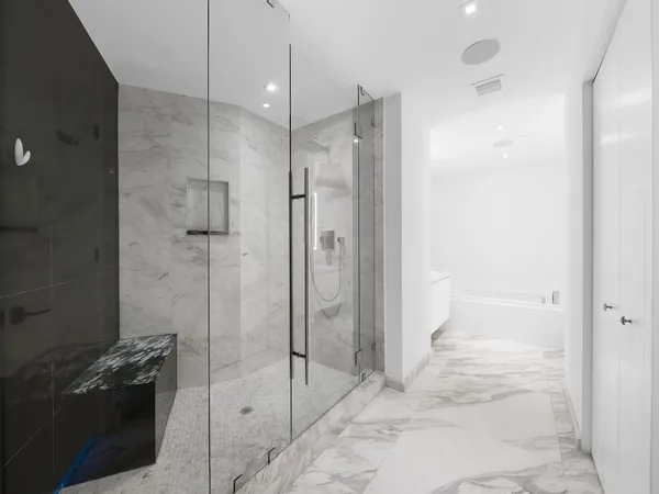 a bathroom with a shower and a sink