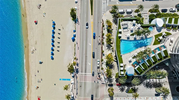 a view of swimming pool with a table and chairs