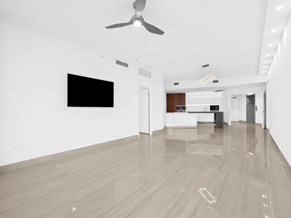a view of a living room a flat screen tv