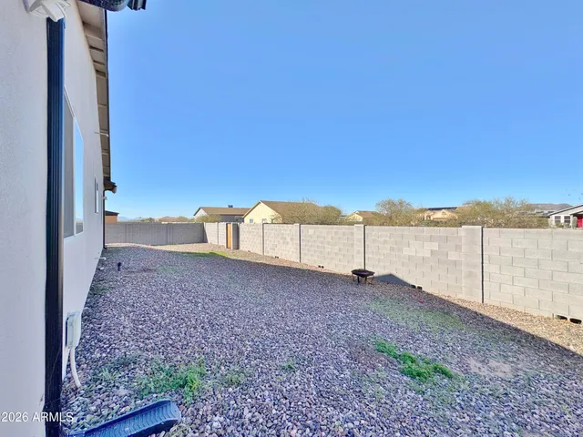 a view of house with backyard