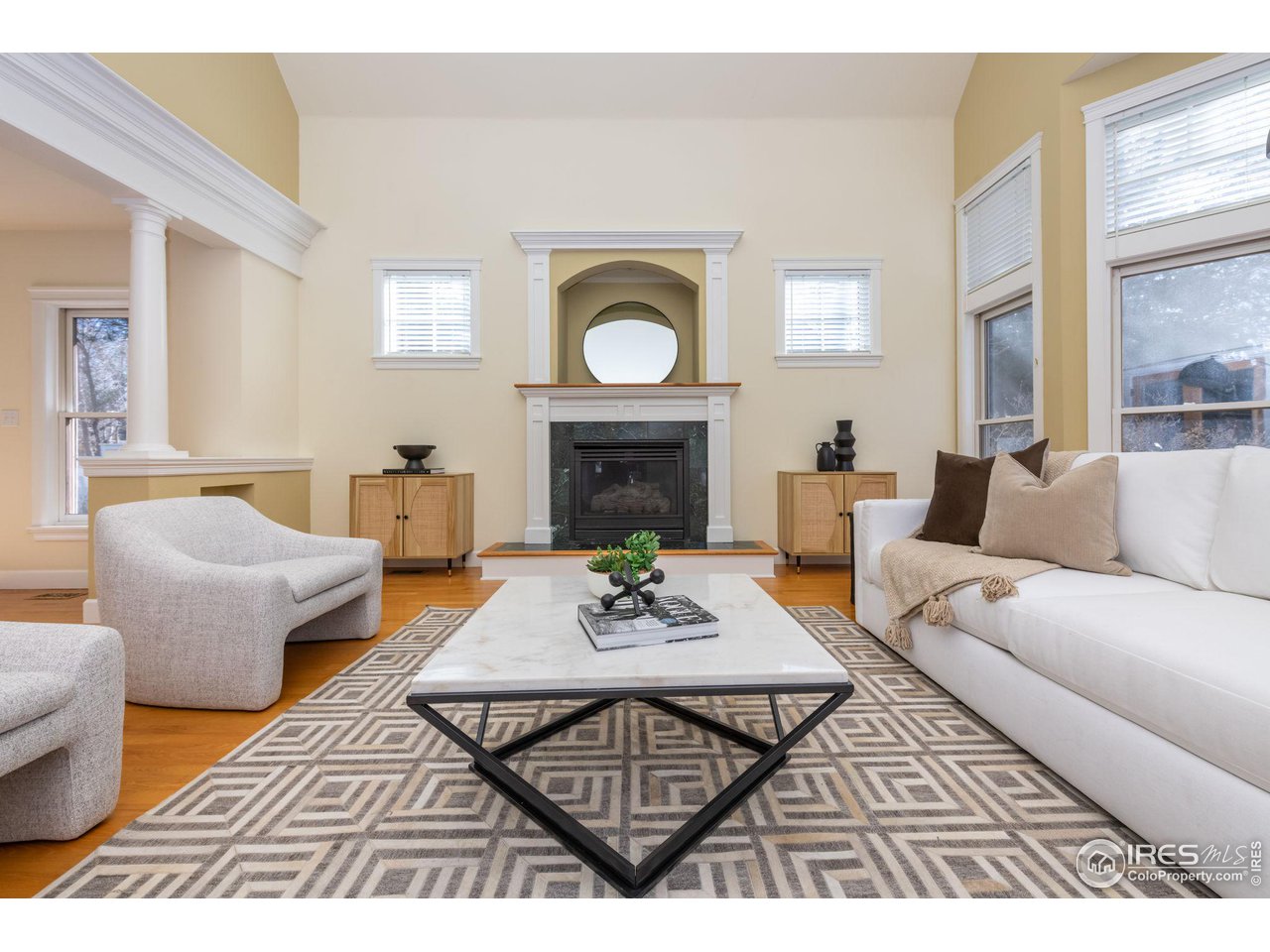 3754 26th Street Boulder, CO 80304 - Photo 11 of 34 a living room with furniture a fireplace and a table