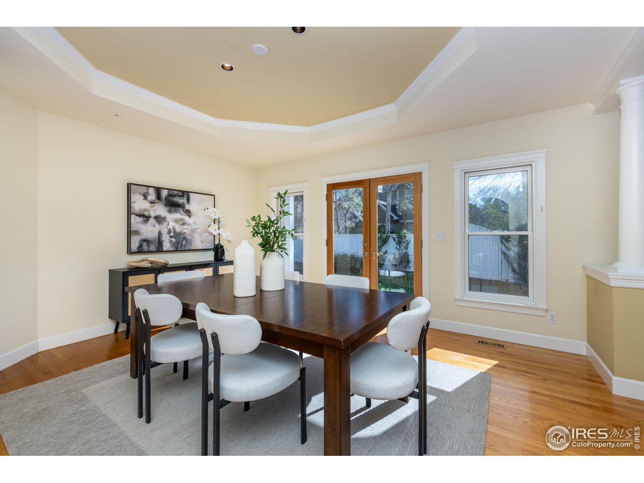 3754 26th Street Boulder, CO 80304 - Photo 12 of 34 a dining room with furniture and wooden floor