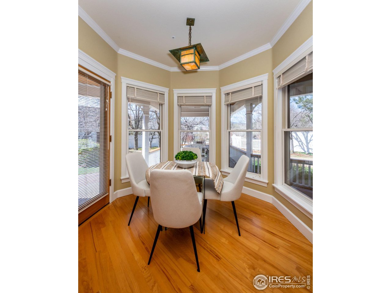 3754 26th Street Boulder, CO 80304 - Photo 15 of 34 a dining room with furniture a chandelier and wooden floor