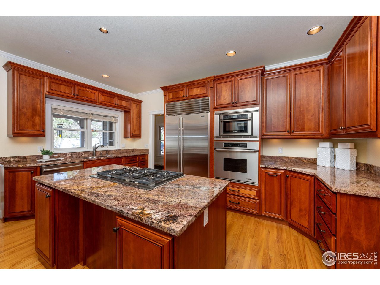 3754 26th Street Boulder, CO 80304 - Photo 17 of 34 a kitchen with stainless steel appliances granite countertop a sink stove and refrigerator
