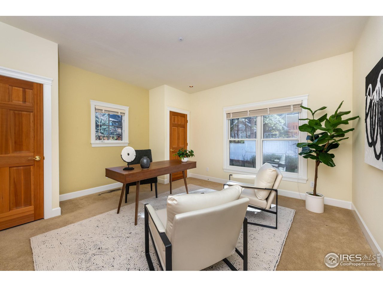 3754 26th Street Boulder, CO 80304 - Photo 18 of 34 a living room with furniture potted plant and a wooden floor