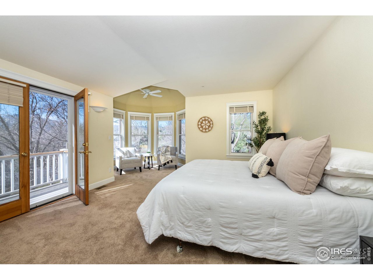 3754 26th Street Boulder, CO 80304 - Photo 21 of 34 a bedroom with a large bed and a large window
