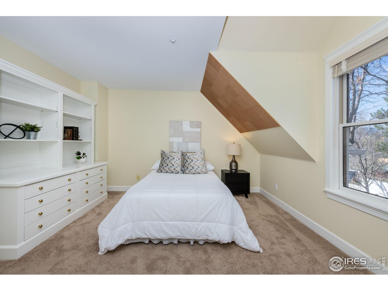 3754 26th Street Boulder, CO 80304 - Photo 25 of 34 a bedroom with a large bed and a window