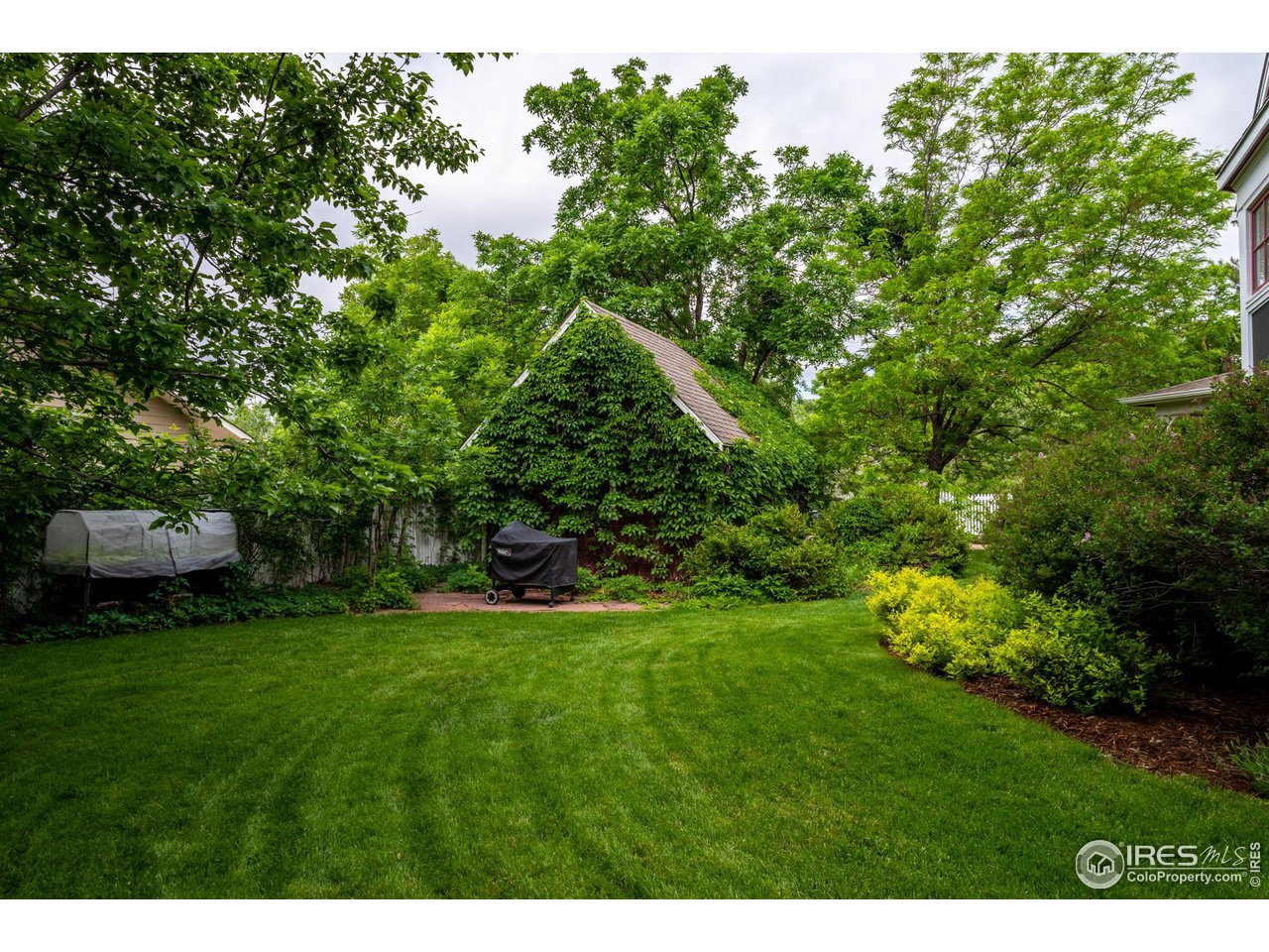 3754 26th Street Boulder, CO 80304 - Photo 30 of 34 a view of a grassy field with trees