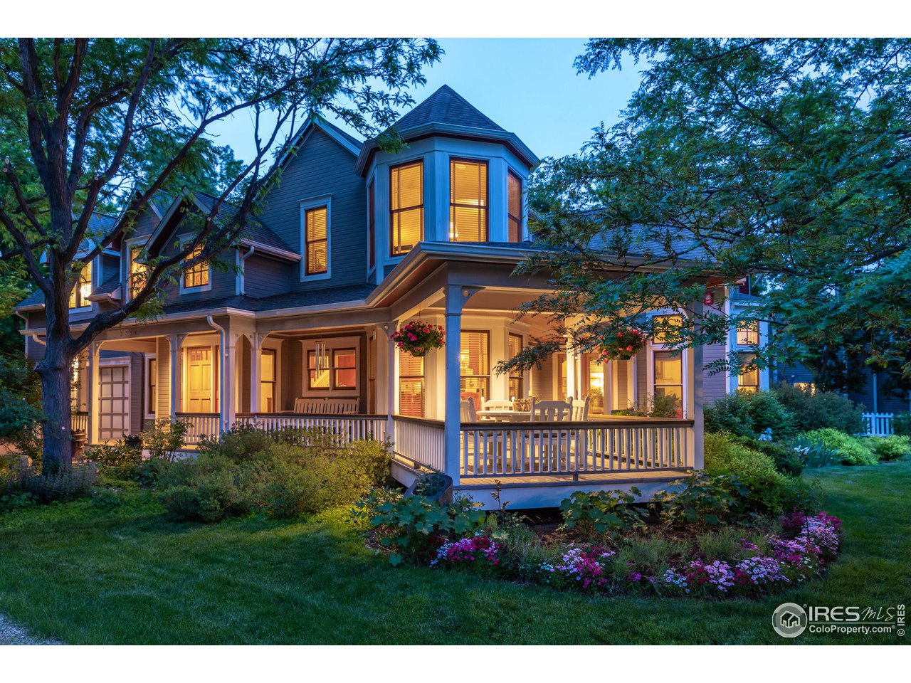 3754 26th Street Boulder, CO 80304 - Photo 33 of 34 a view of a brick house with large windows and a flower plants