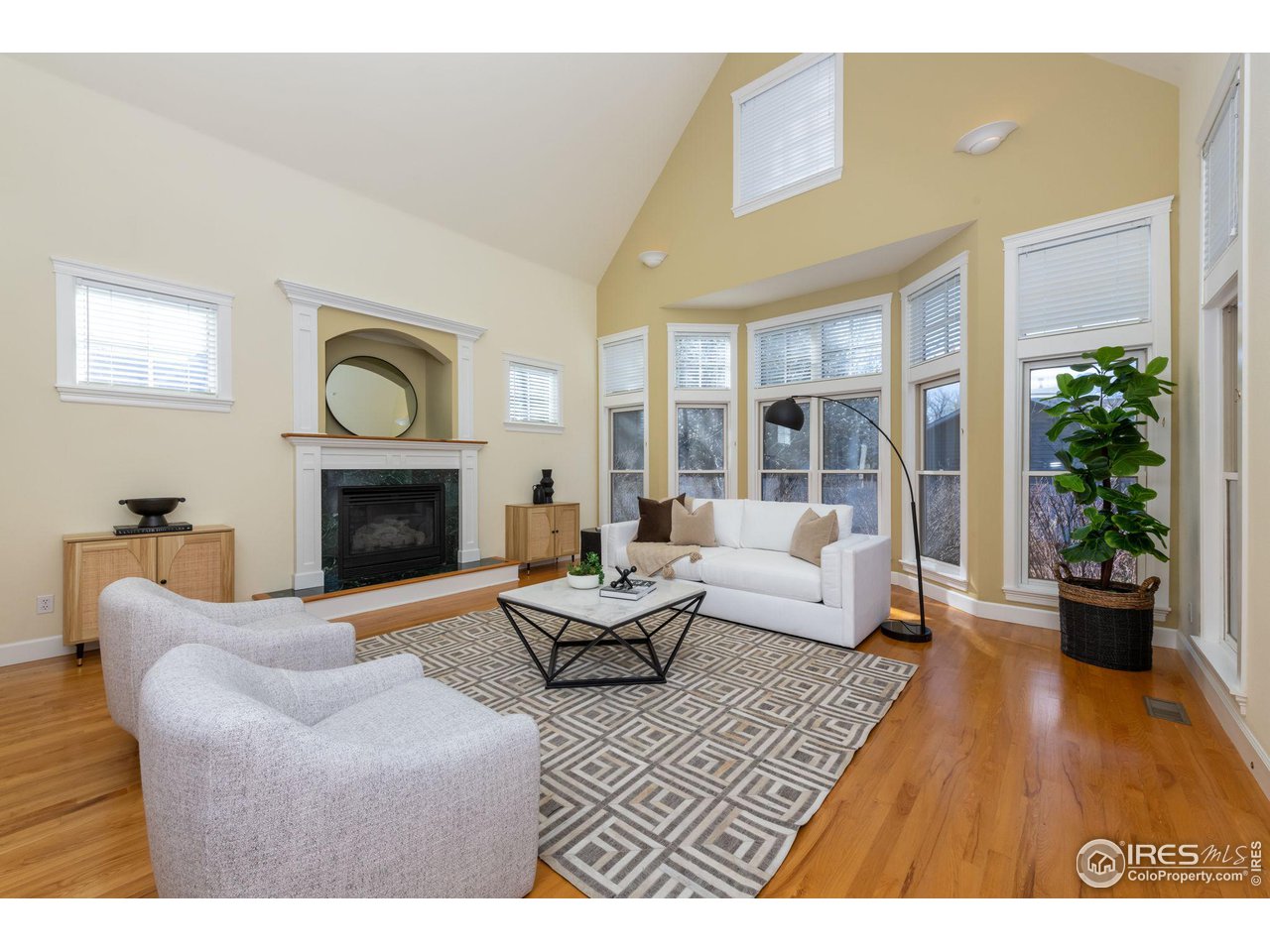 3754 26th Street Boulder, CO 80304 - Photo 10 of 34 a living room with furniture a window and a fireplace
