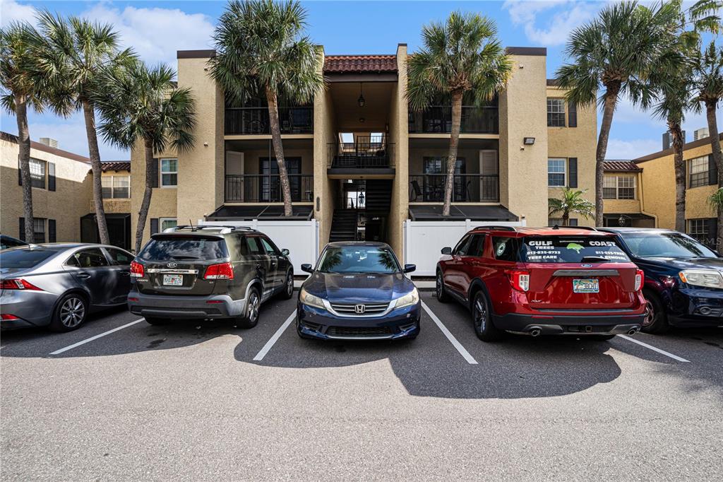5306 Santa Rosa Court, Unit 341 Tampa, FL 33609 - Photo 14 of 20 a car parked in front of a houses