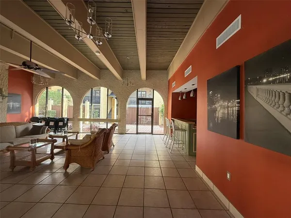 a lobby with furniture and window