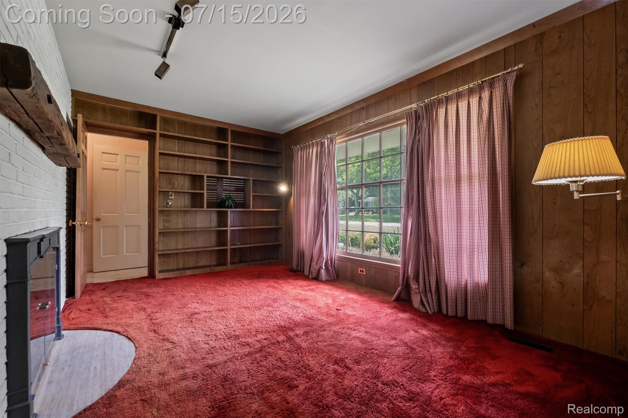 1151 Peveril Road Bloomfield Hills, MI 48304 - Photo 29 of 39 Cozy library with built in bookshelves and traditional wood paneling