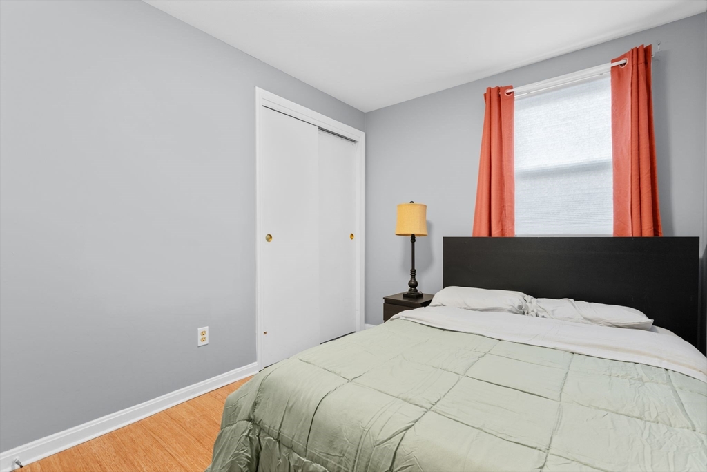 62 Emily Jeffers Road, Unit 62 Randolph, MA 02368 - Photo 17 of 31 a bedroom with a bed and a window