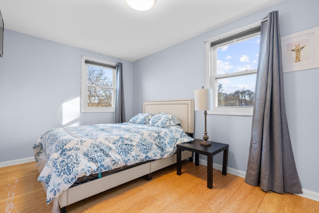 62 Emily Jeffers Road, Unit 62 Randolph, MA 02368 - Photo 19 of 31 a bedroom with a bed and a window