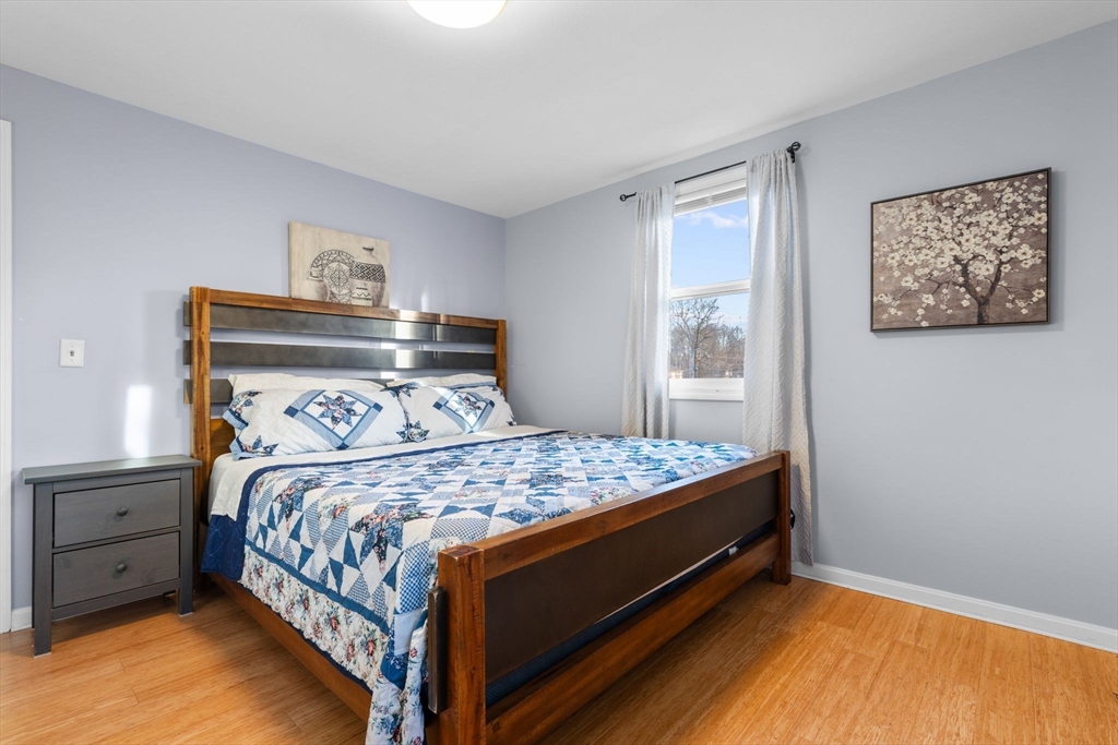 62 Emily Jeffers Road, Unit 62 Randolph, MA 02368 - Photo 23 of 31 a bedroom with a bed and a window