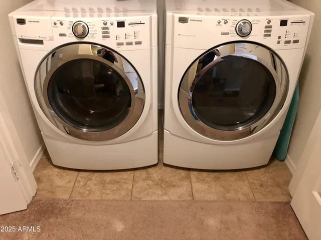 a view of washer and dryer in a utility room