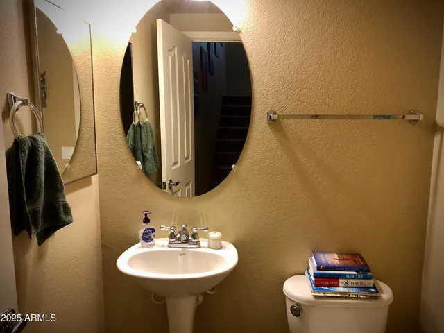 a bathroom with a sink and mirror