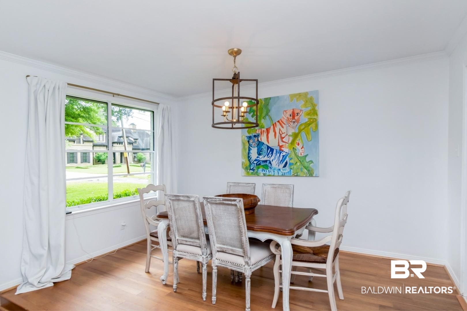 4596 Hawthorne Place Mobile, AL 36608 - Photo 5 of 34 Dining area featuring wood-finish flooring, white walls, and a large window