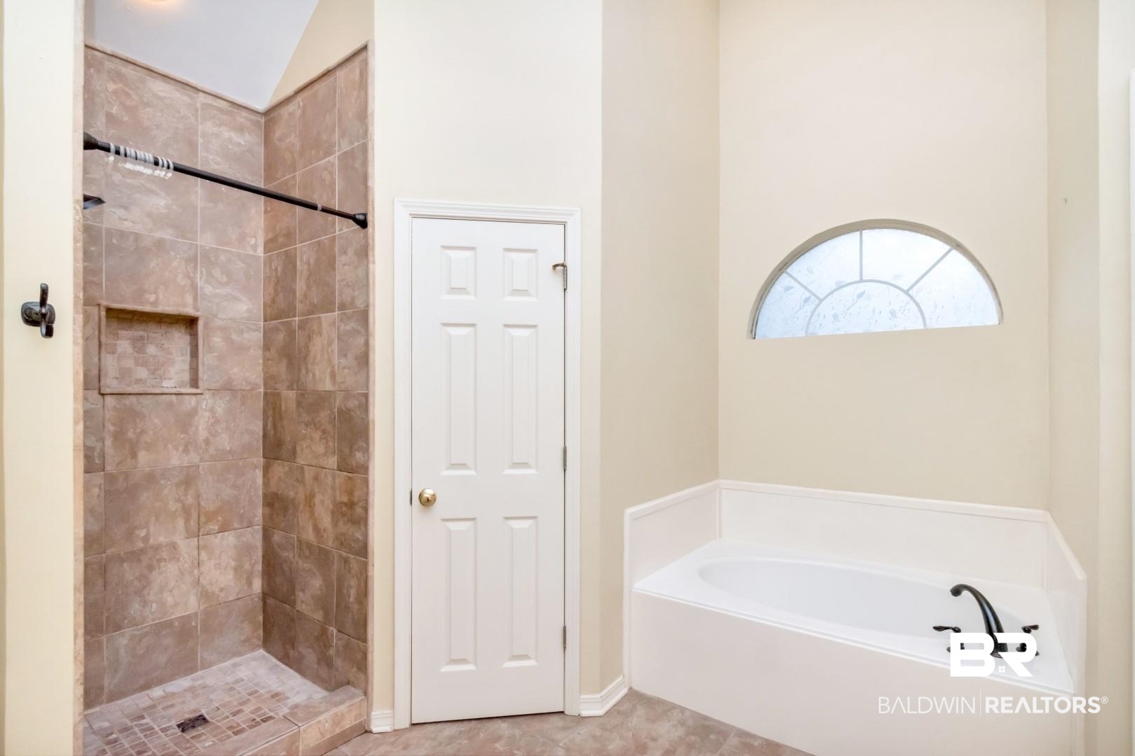 152 Ideal Avenue Mobile, AL 36608 - Photo 25 of 32 Bathroom featuring tile patterned flooring, shower with separate bathtub, and vaulted ceiling