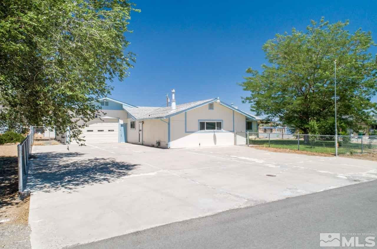 185 Ring Road Dayton, NV 89403 - Photo 1 of 29 a front view of a house with a yard
