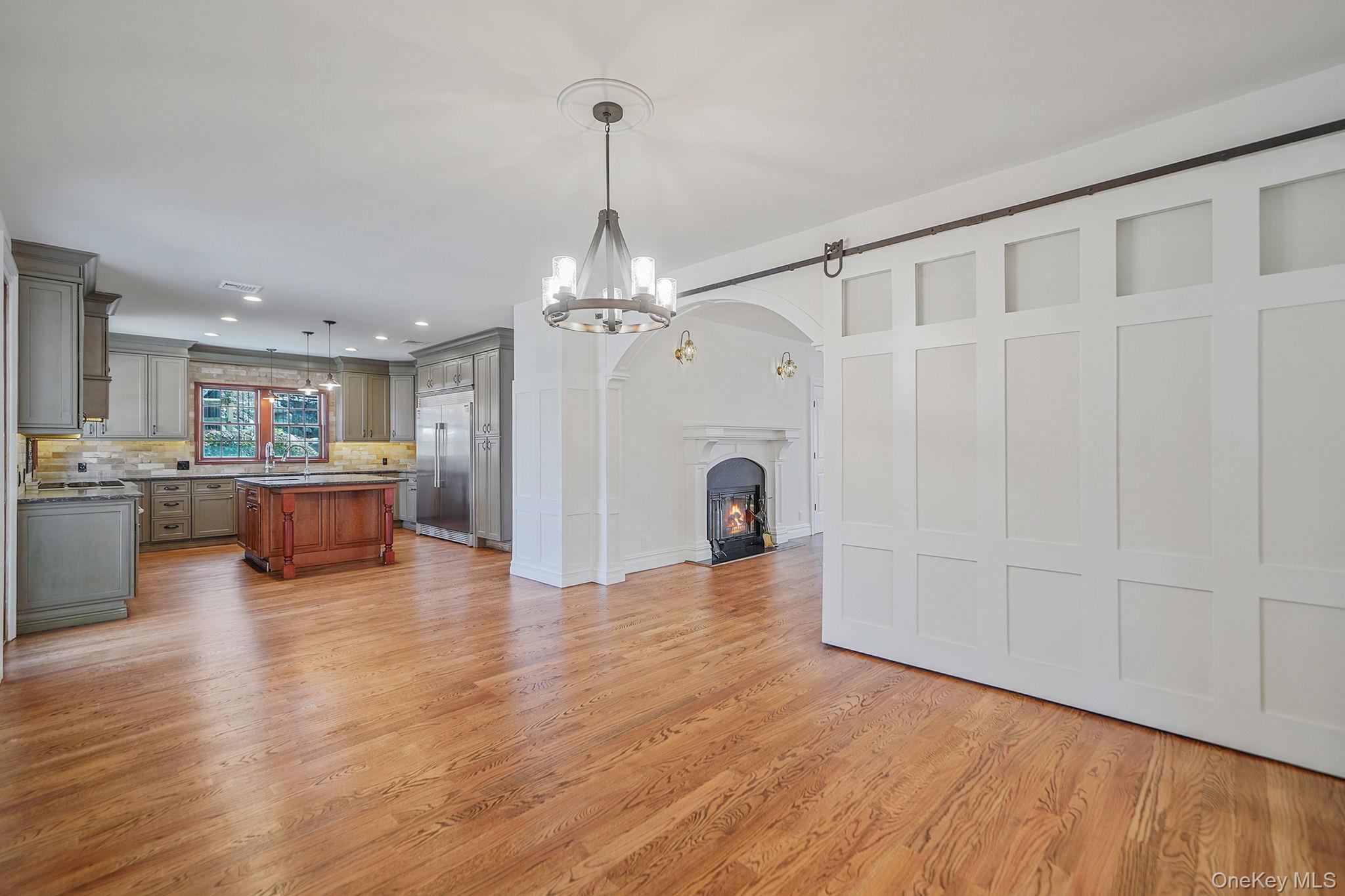 368 Main Street Setauket, NY 11733 - Photo 12 of 41 a view of a livingroom with furniture wooden floor and chandelier