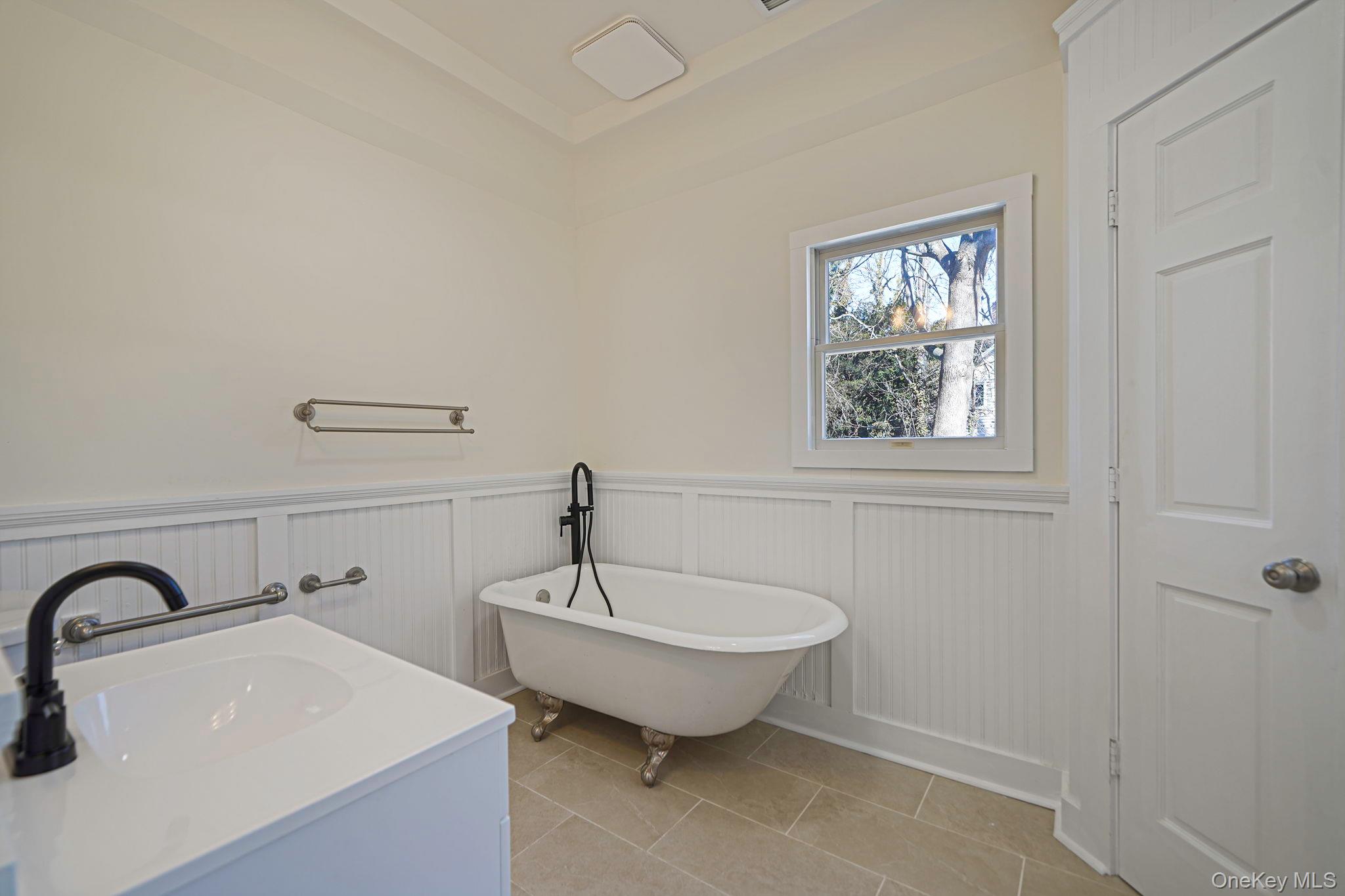 368 Main Street Setauket, NY 11733 - Photo 13 of 41 a bathroom with 2 sink and a window