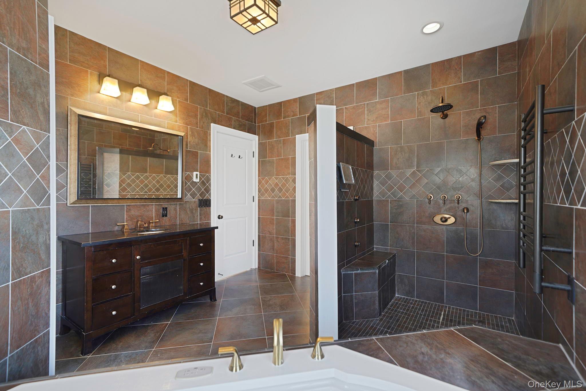 368 Main Street Setauket, NY 11733 - Photo 20 of 41 a bathroom with a double vanity sink toilet and shower