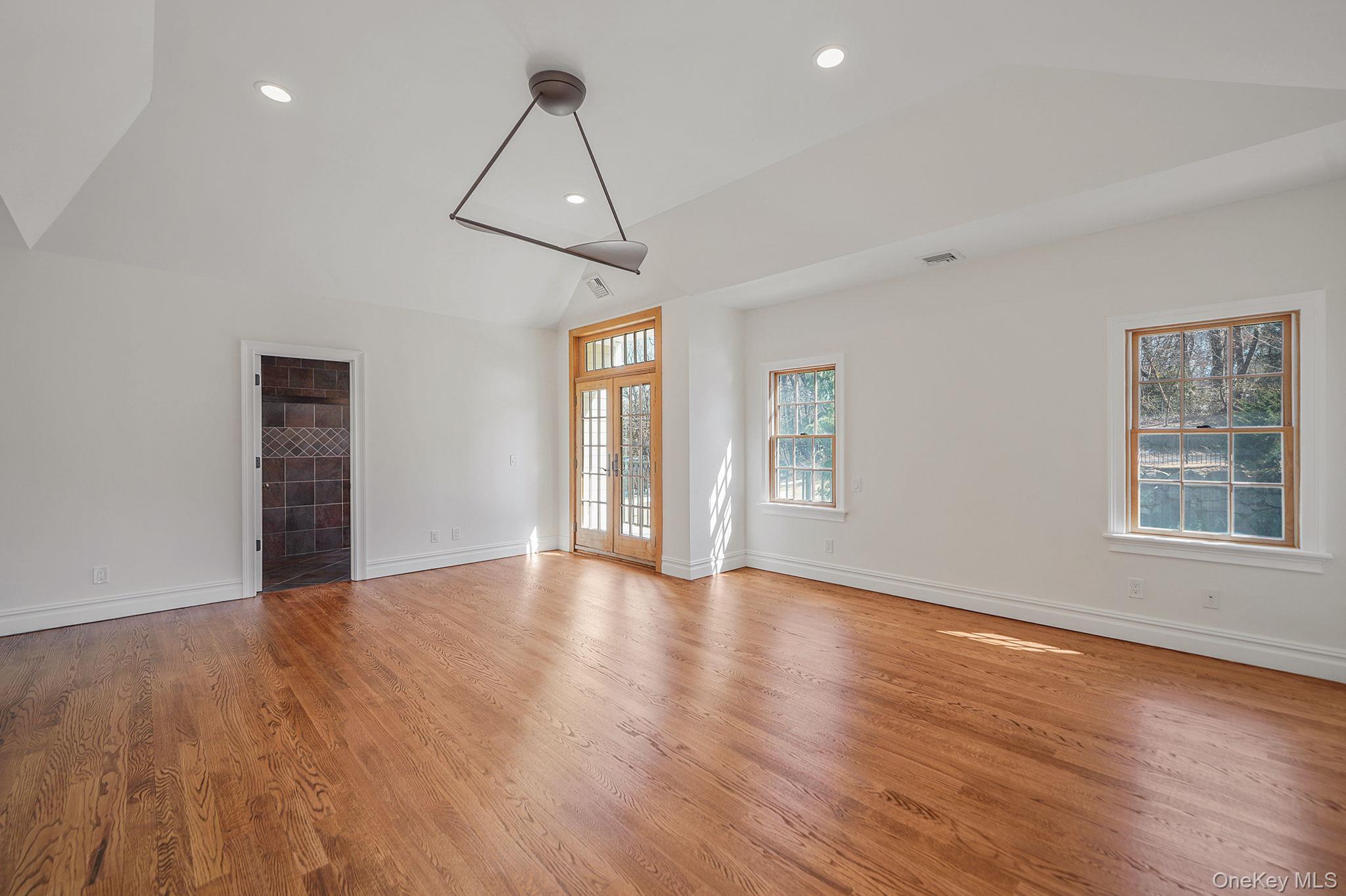 368 Main Street Setauket, NY 11733 - Photo 21 of 41 a view of empty room with wooden floor and fan