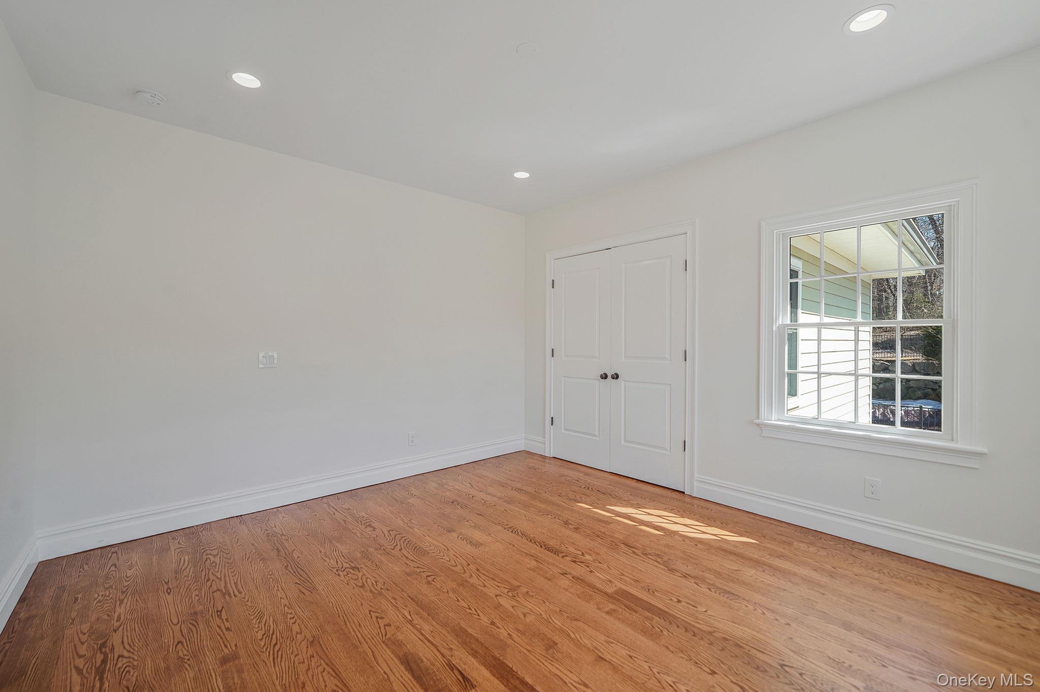 368 Main Street Setauket, NY 11733 - Photo 27 of 41 a view of empty room with wooden floor and fan