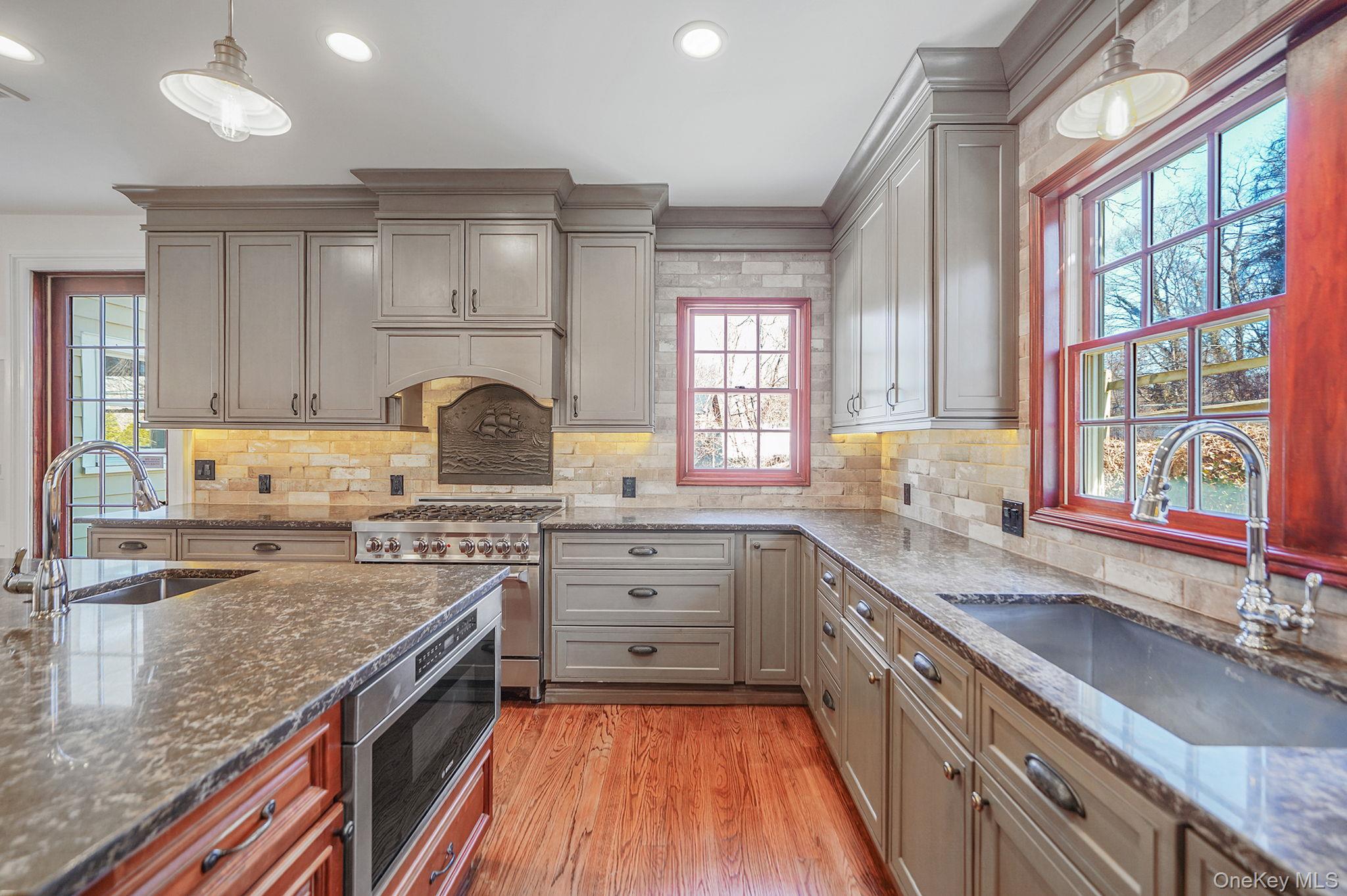 368 Main Street Setauket, NY 11733 - Photo 3 of 41 a kitchen with a stove a sink and a granite counter tops