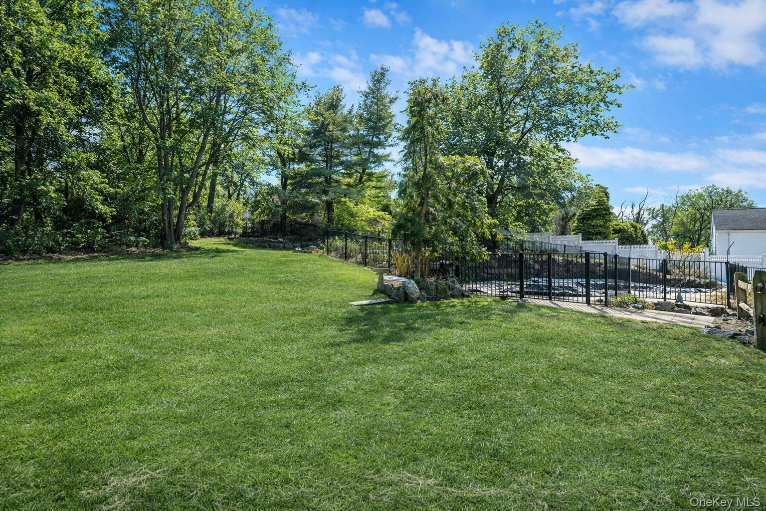 368 Main Street Setauket, NY 11733 - Photo 38 of 41 a view of a backyard with sitting area