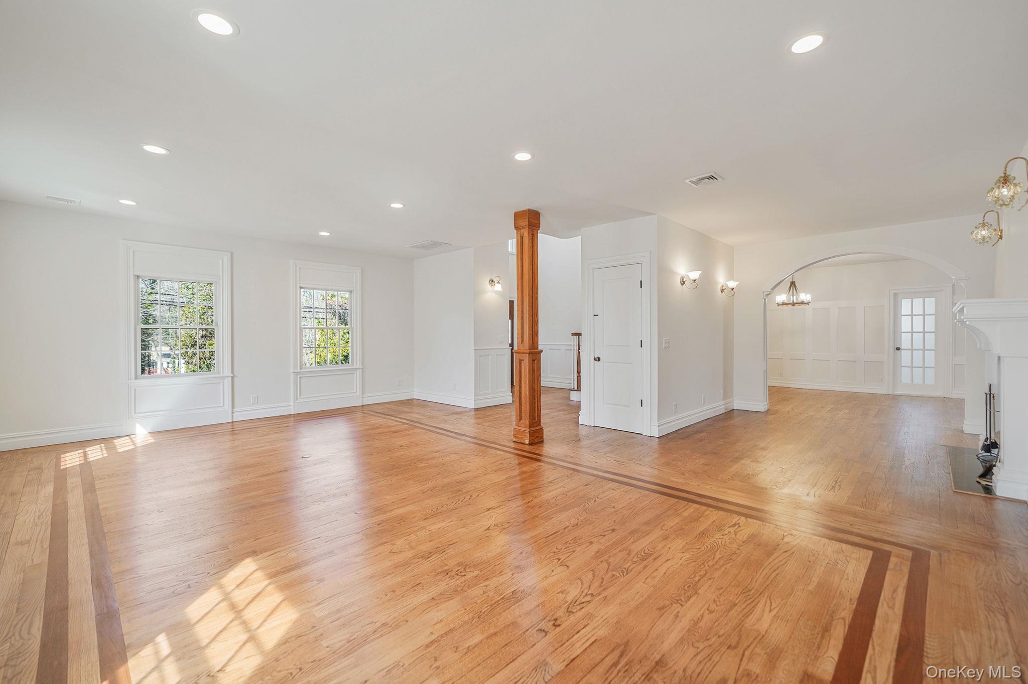 368 Main Street Setauket, NY 11733 - Photo 5 of 41 a view of an empty room with window and wooden floor