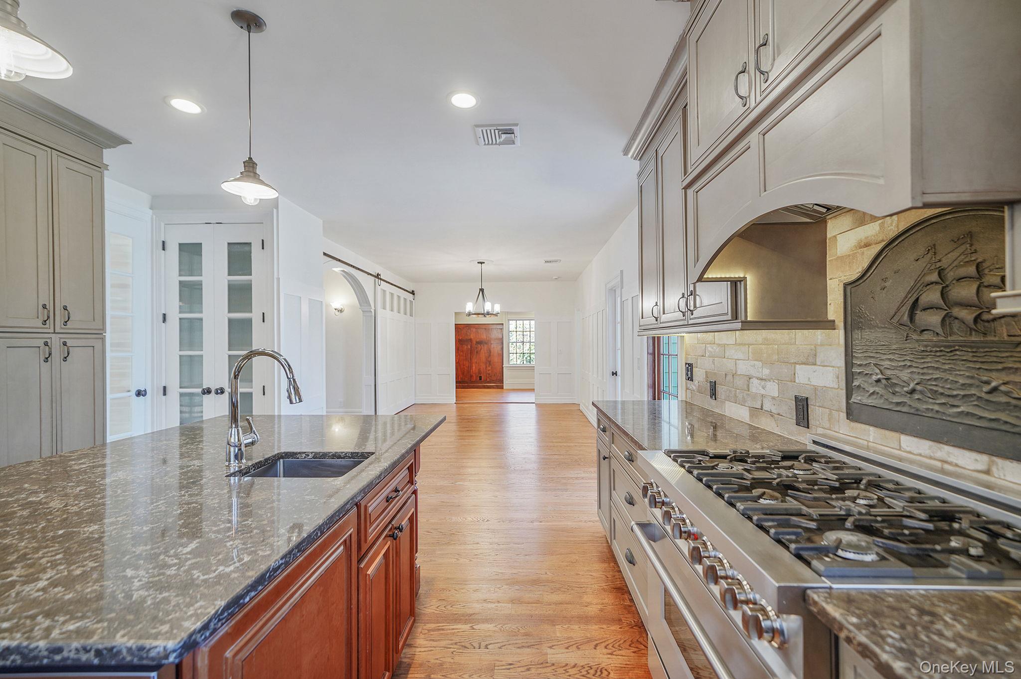 368 Main Street Setauket, NY 11733 - Photo 6 of 41 a kitchen with sink stove and cabinets