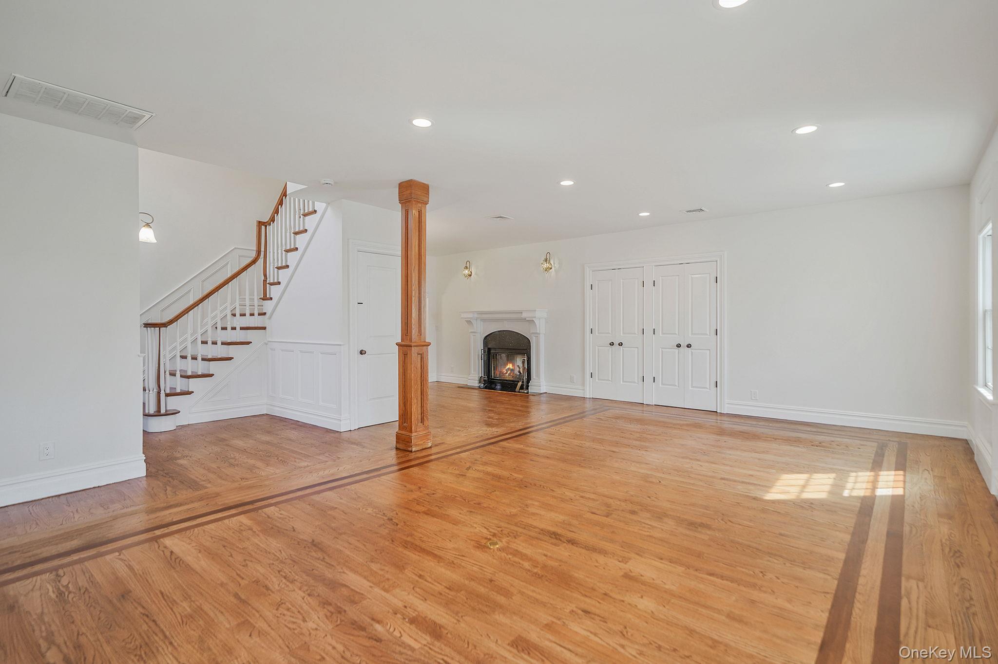 368 Main Street Setauket, NY 11733 - Photo 7 of 41 a view of an empty room with wooden floor