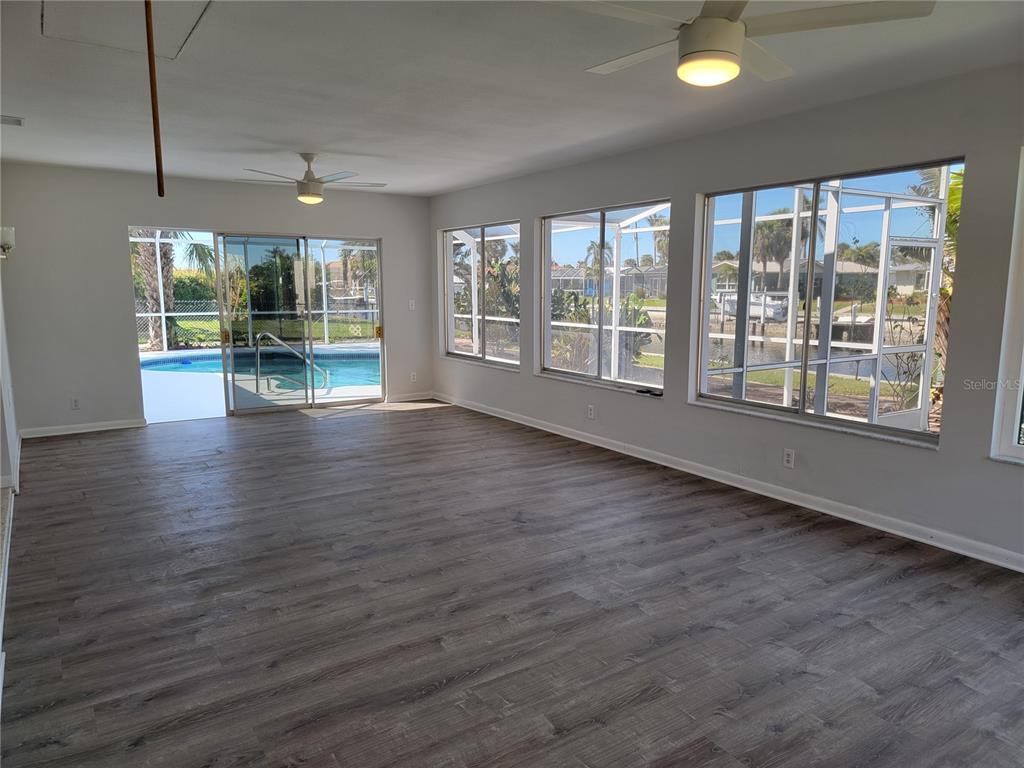 1732 Boca Raton Court Punta Gorda, FL 33950 - Photo 44 of 64 a view of an empty room with wooden floor and a window