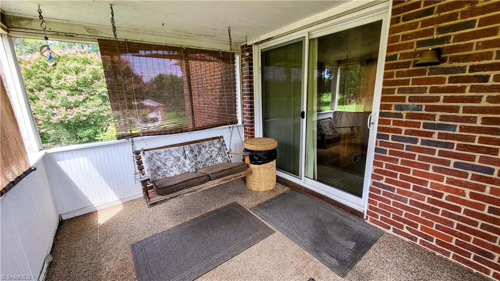 310 Sedge Garden Road Kernersville, NC 27284 - Photo 13 of 34 Enjoy your drinks & the breeze on the porch swing!!