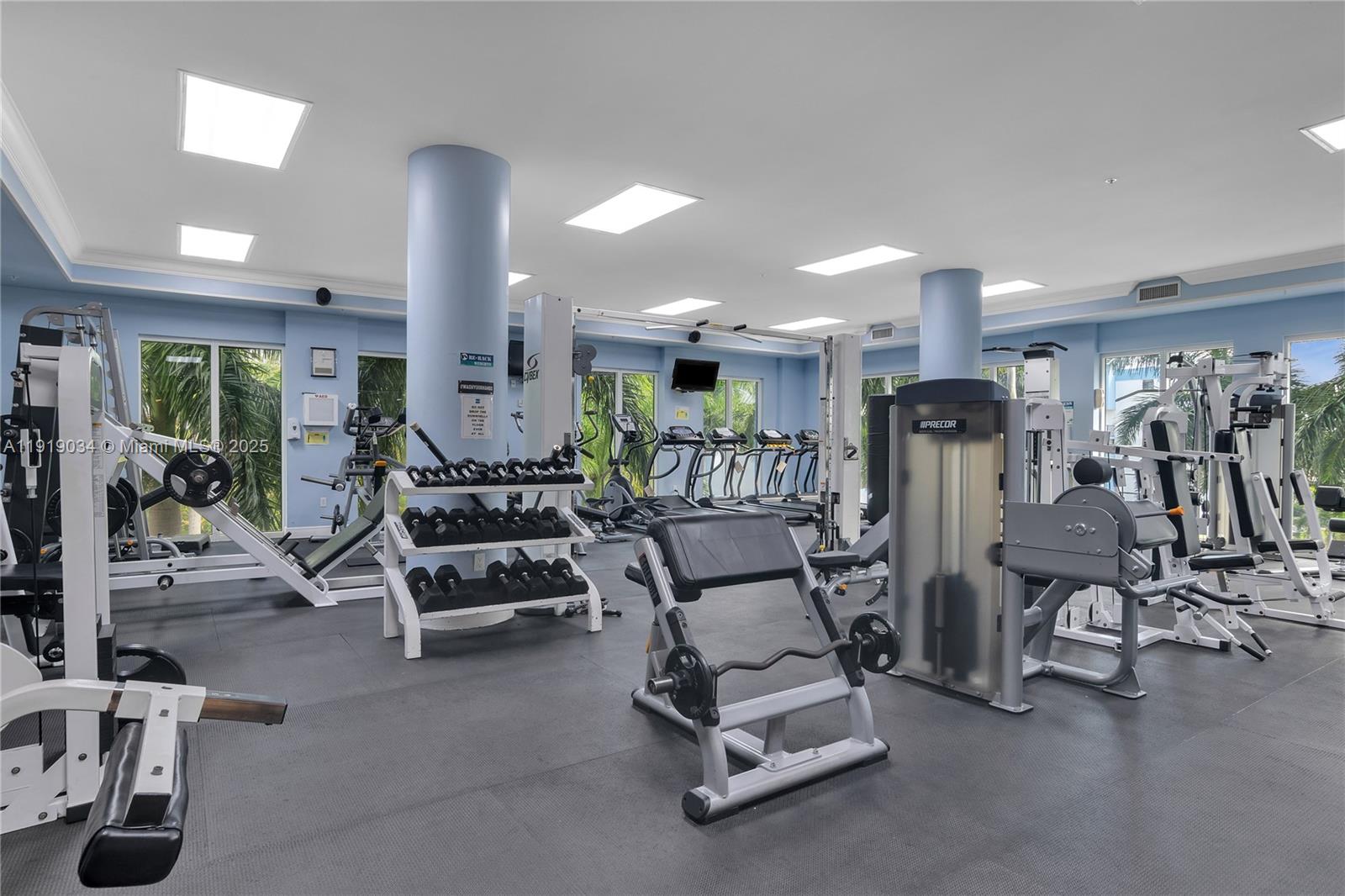 5077 Northwest 7th Street, Unit 610 Miami, FL 33126 - Photo 16 of 20 a view of a room with gym equipment