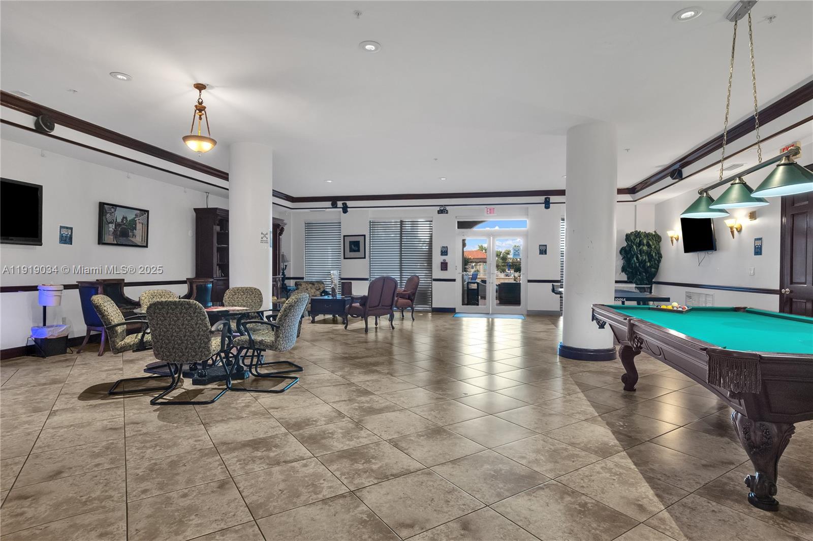 5077 Northwest 7th Street, Unit 610 Miami, FL 33126 - Photo 20 of 20 a lobby with furniture and floor to ceiling window