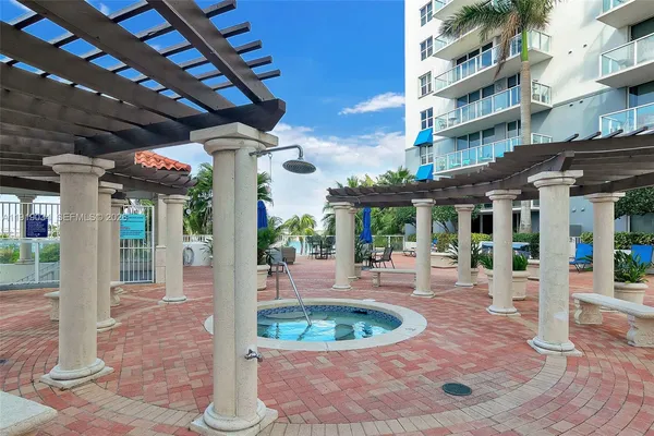 a swimming pool with outdoor seating and yard